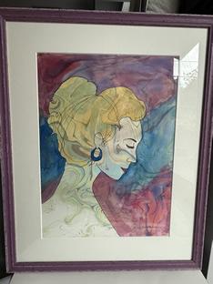 Framed abstract portrait of a person with yellow hair