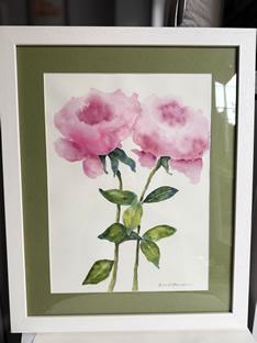 Framed watercolor painting of pink flowers