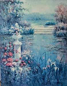 Colorful flowers surrounding a tranquil garden pond